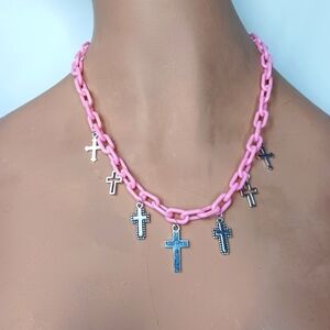 Plastic Baby Pink Link Necklace with Silver Cross Pendants.